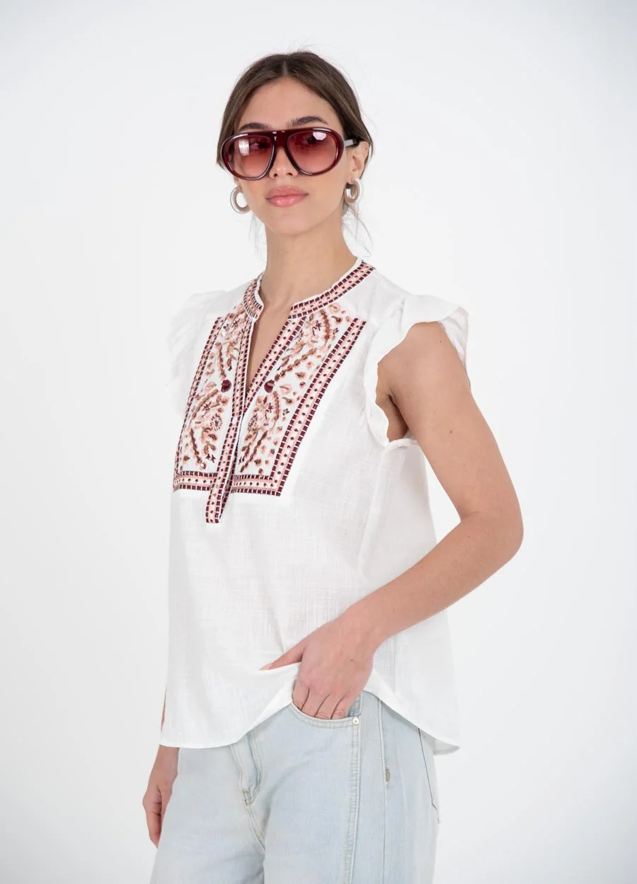 Blusa bordada en colores con volado en hombro 