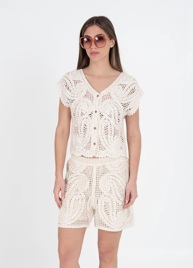 Musculosa tejida arabescos con lentejuelas 