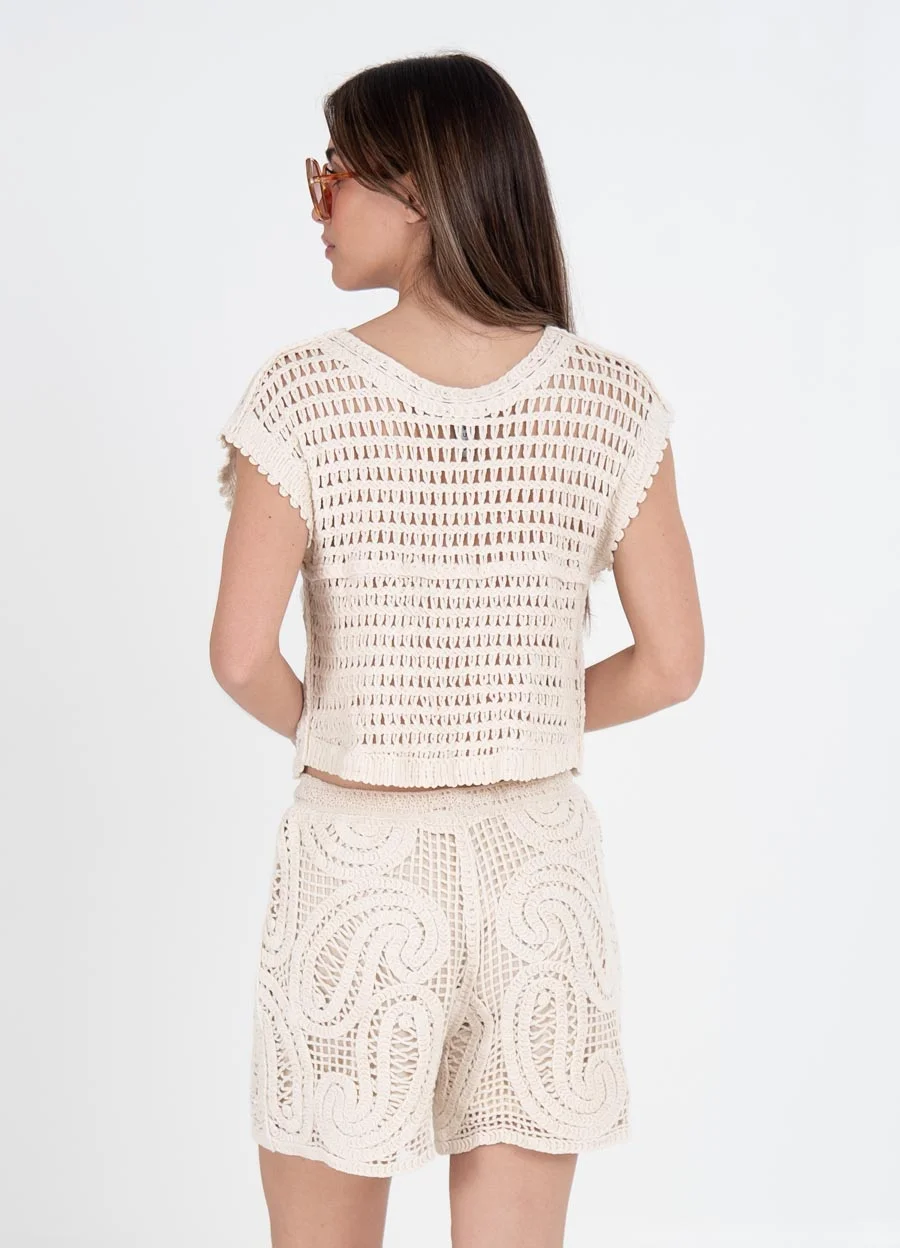 Musculosa tejida arabescos con lentejuelas 