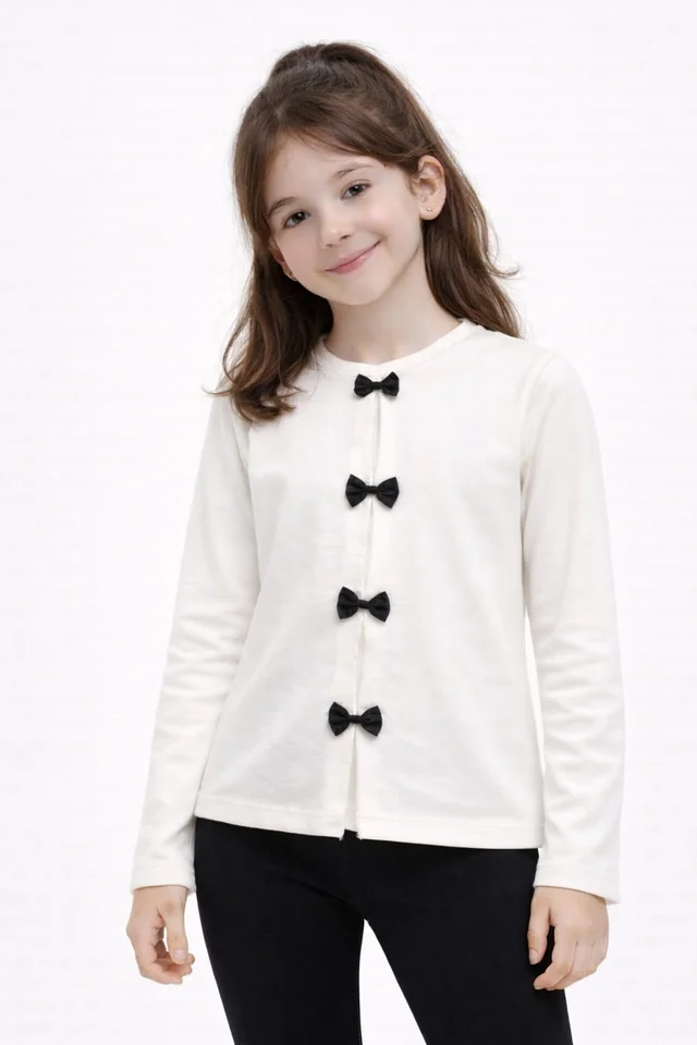 Remera manga larga de nena con pliegues y moños aplicados
