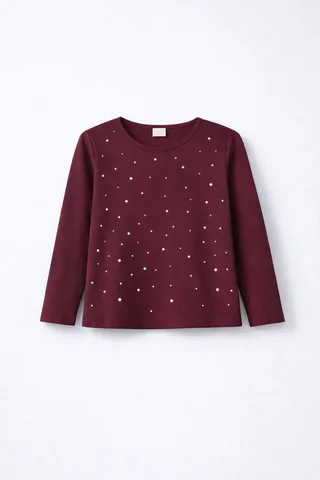 Remera manga larga de nena con aplique de hotfitt brillante  - Vista 2